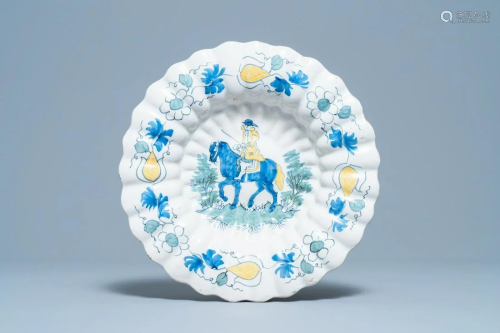 A polychrome Dutch Delft gadrooned dish with a horse