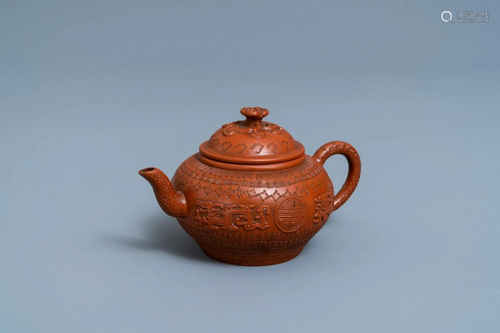 A Chinese Yixing stoneware teapot and cover with