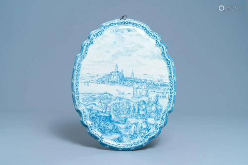 A large Dutch Delft blue and white plaque with a view