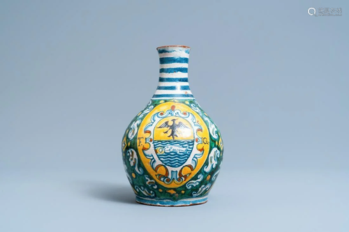 A polychrome Italian maiolica armorial pharmacy bottle,