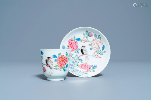 A Chinese famille rose cup and saucer with a bird on a