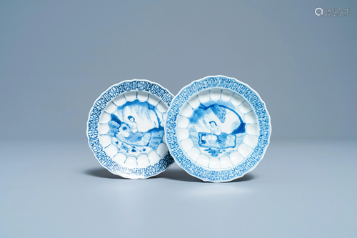 A pair of Chinese blue and white 'acupuncture' saucers,