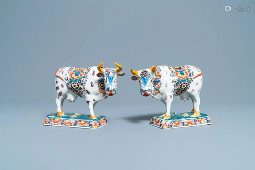 A pair of of polychrome Dutch Delft models of cows,