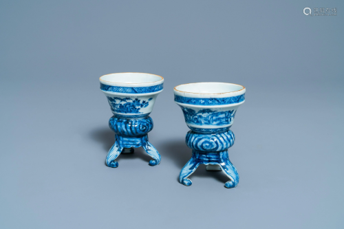A pair of Chinese blue and white rococo-style tripod