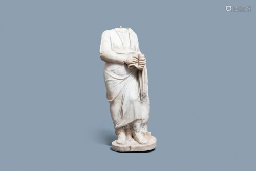 A Roman marble statue of a philosopher holding a