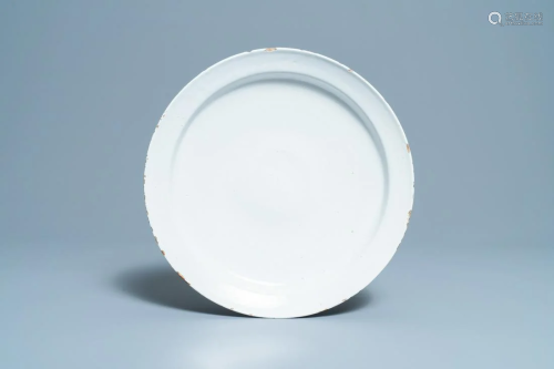 A white Delftware dish, 18th C.