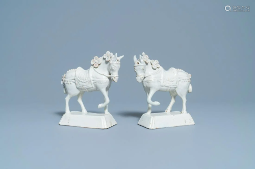 A pair of white Dutch Delftware models of horses, 18th