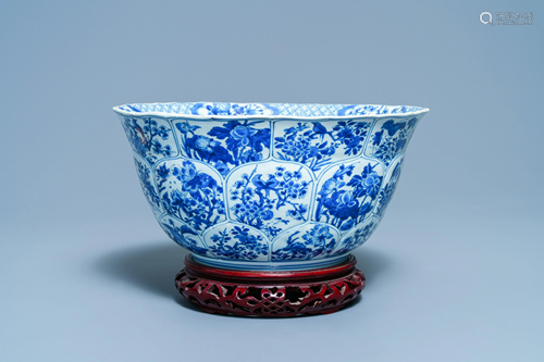 A large Chinese blue and white bowl with floral panels,