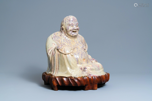 A massive Chinese flambé-glazed Shiwan pottery figure