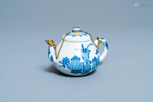 A Chinese gilt-mounted blue and white teapot and cover,