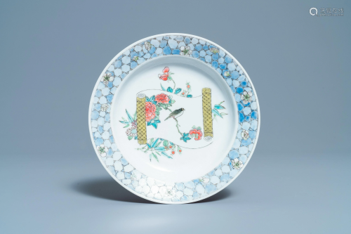 A Chinese famille rose 'ruby back' plate with a bird on