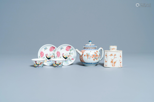 A pair of Chinese famille rose cups and saucers, a