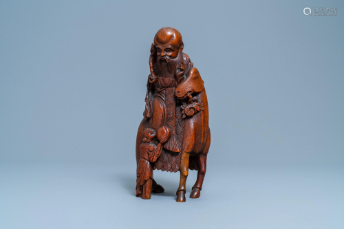 A Chinese bamboo wood carving of Shou Lao on a deer,