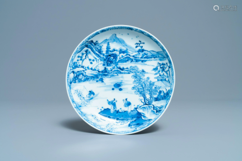 A Chinese blue and white plate with figures in a