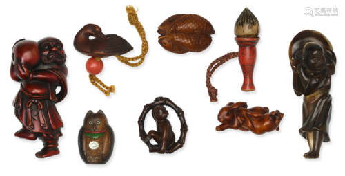 A group of seven wood netsuke and one horn netsuke Edo period (1615-1868) to Showa era (1926-1989), 19th and 20th century