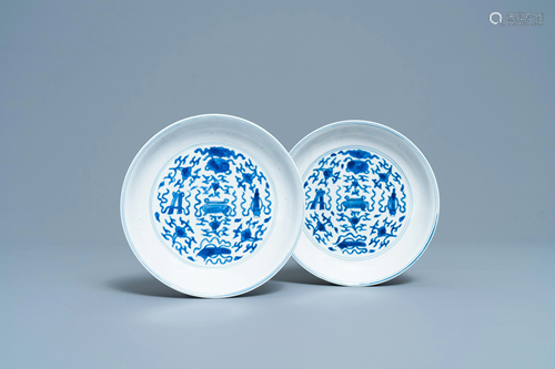 A pair of Chinese blue and white plates with taoist