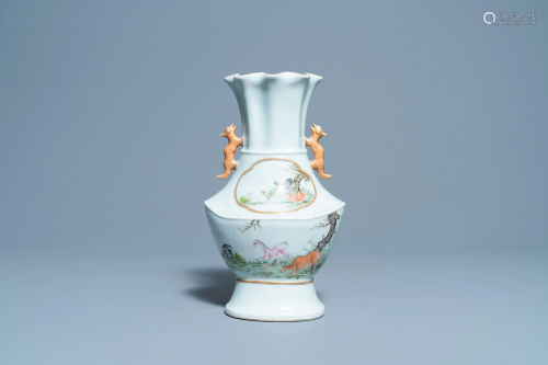 A Chinese famille rose vase with animals in a