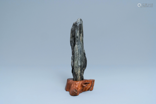 A Chinese scholar's dream stone on wooden stand, 19th
