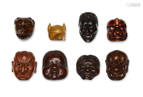 A group of eight large wood mask netsuke Edo period (1615-1868) or Meiji era (1868-1912), 19th/20th century, and Showa era (1926-1989), late 20th century