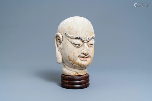 A Chinese painted sandstone head of a luohan, Ming