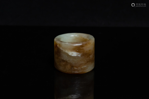 A Chinese mottled celadon jade archer's ring, Ming