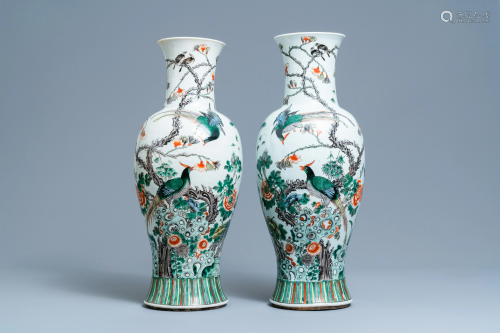 A pair of Chinese famille verte vases with birds among