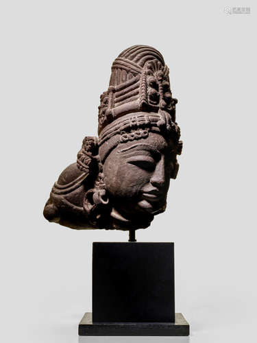 A SANDSTONE HEAD OF A SHIVA NORTHERN INDIA, CIRCA 10TH CENTURY