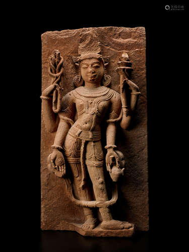 A SANDSTONE STELE OF A DEITY NORTHERN INDIA, CIRCA 10TH CENTURY