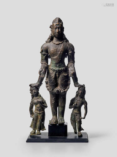 A COPPER ALLOY FIGURE OF VISHNU WITH GADANARI AND CHAKRAPURUSHA NORTHEASTERN INDIA, BIHAR, POST-GUPTA PERIOD, CIRCA 8TH CENTURY