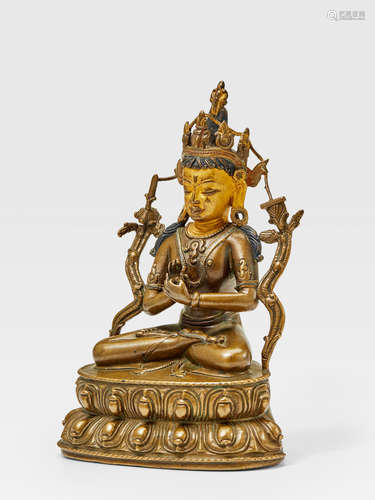 A SILVER AND COPPER INLAID BRASS FIGURE OF MANJUSHRI WEST TIBET, 14TH CENTURY