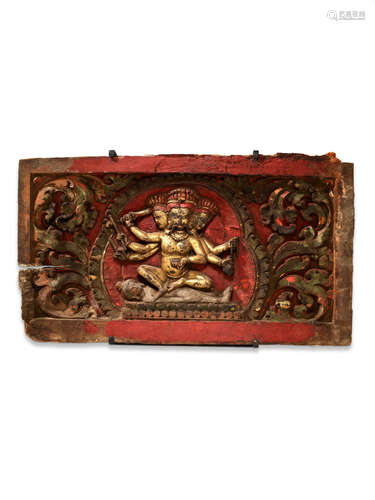 A GILT LACQUER AND POLYCHROME WOOD PANEL WITH A PROTECTOR GODDESS NEPAL, 13TH/14TH CENTURY