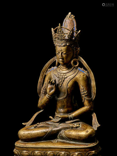 A BRASS FIGURE OF AMOGHASIDDHI TIBET, 13TH/14TH CENTURY