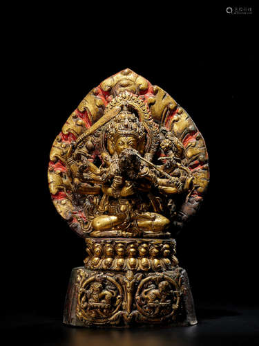 A CAST AND REPOUSSÉ GILT COPPER ALLOY SHRINE TO MANJUVAJRA NEPAL, 17TH/18TH CENTURY