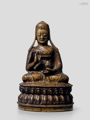 A BRASS FIGURE OF THE SECOND ABBOT OF NGOR MONASTERY, MUCHEN KONCHOG GYALTSEN CENTRAL TIBET, 15TH/16TH CENTURY