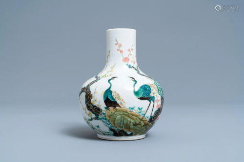 A Chinese famille rose bottle vase with peacocks,