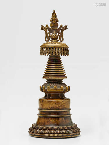 A COPPER ALLOY MAHAPARINIRVANA STUPA TIBET, CIRCA 14TH CENTURY