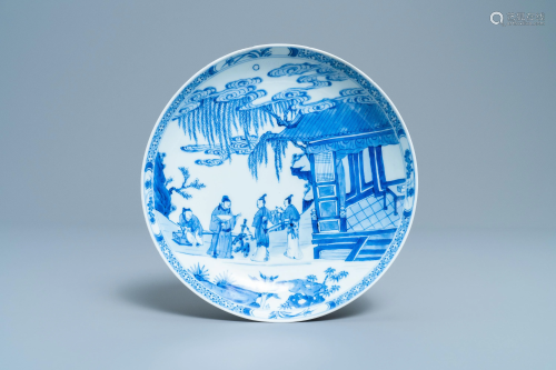 A Chinese blue and white plate with figures in a
