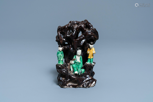 A Chinese verte biscuit group with figures near a cave,