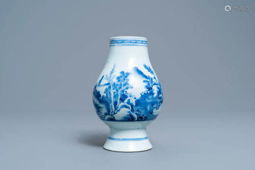 A Chinese blue and white vase with a landscape with