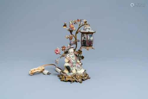 A Chinese famille verte figure mounted into a lamp with