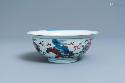 A Chinese blue, white and copper red bowl with Buddhist
