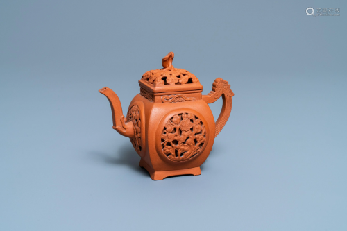 A Chinese reticulated Yixing stoneware teapot and