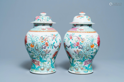 A pair of Chinese famille rose vases and covers,