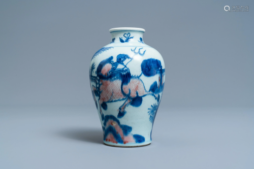 A Chinese blue, white and copper red 'qilin and