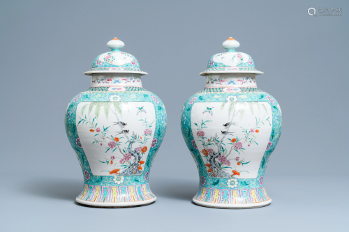 A pair of Chinese famille rose vases and covers, 19th