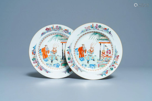 A pair of Chinese famille rose plates with figures in a