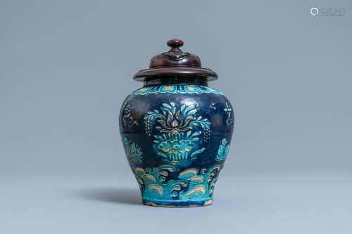 A Chinese fahua vase with mandarin ducks in a lotus