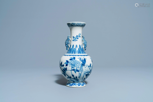 A Chinese blue and white vase with a bird among