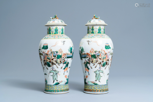 A pair of Chinese famille verte vases and covers with