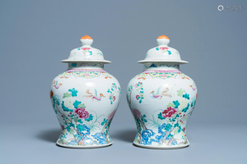 A pair of Chinese famille rose vases and covers, 19th